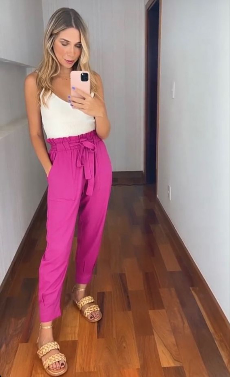 shoulder, pink casual trouser, white crop top, beige sandal
