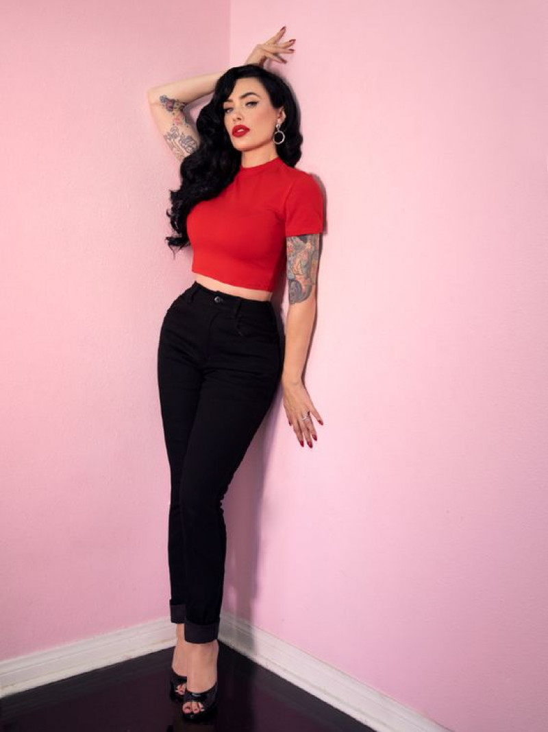 red crop top and high-waisted black pants