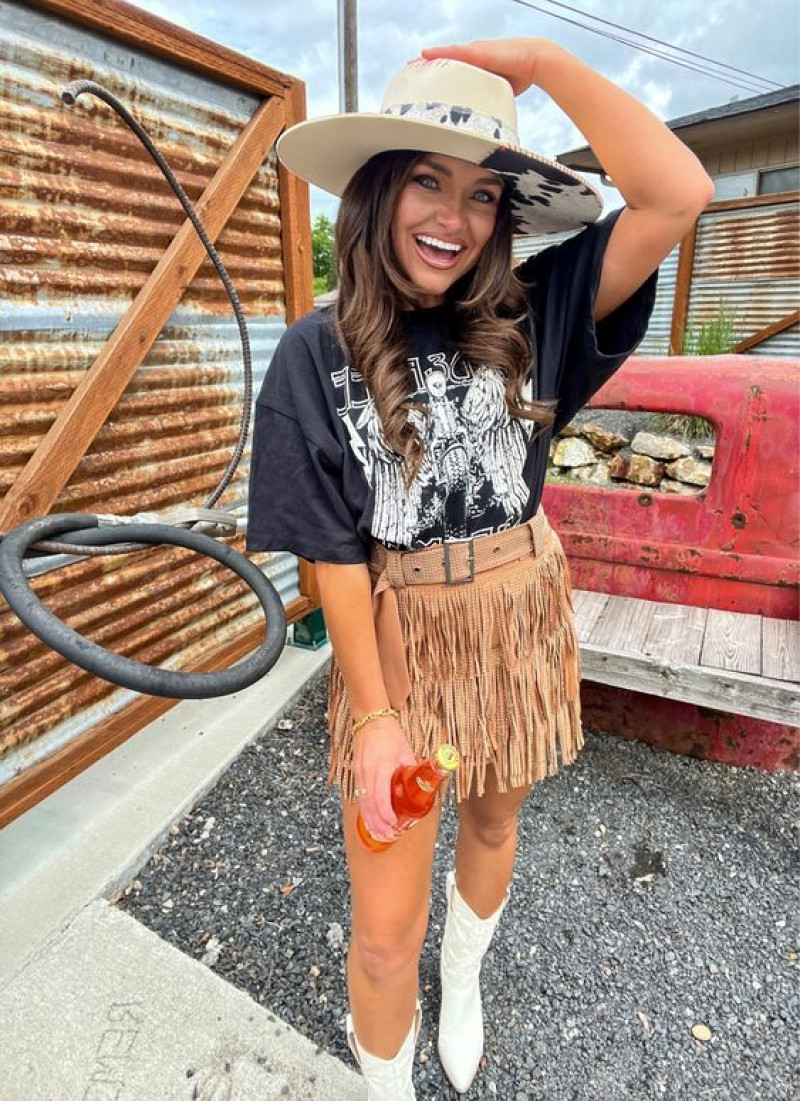 leather skirt, sun hat, blue t-shirt, orange a-line skirt skirt, white chelsea and ankle boot