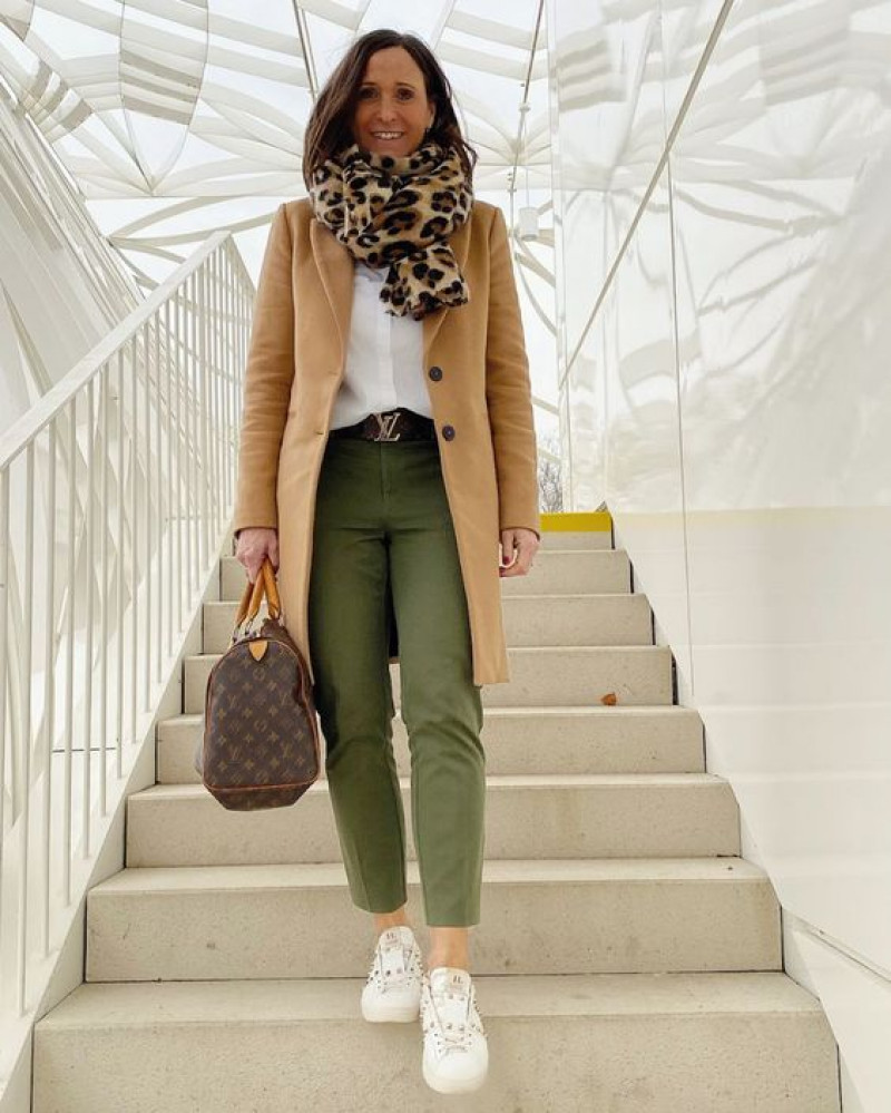 beige wool coat, green casual trouser, white sneaker