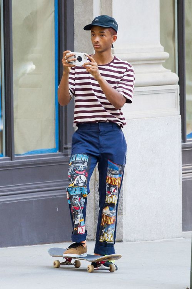 jeans, skateboard truck, sports equipment, hip hop fashion, jaden smith, blue casual trouser, t-shirt, multicolor formal sandal