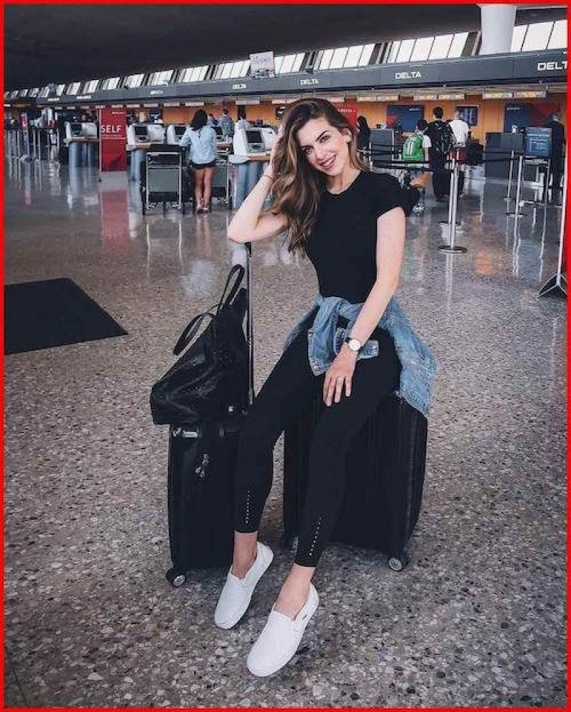 airport outfit for women, luggage and bags, airport fashion, women's dress, black casual trouser, black t-shirt, white free time shoe