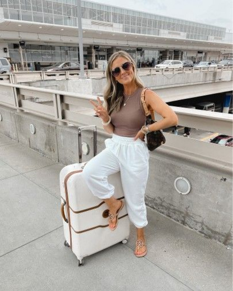 shoulder, white casual trouser, beige crop top, beige flip-flop