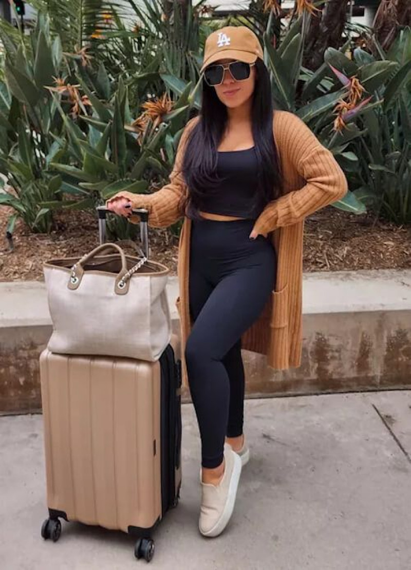 shoulder, miami international airport, winter clothing, travel fashion, black midi sheath dress, blue casual legging, beige sneaker, black casual boot chelsea and ankle boot
