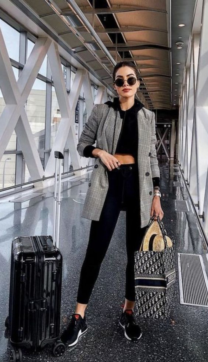 airport outfit, luggage and bags, airport fashion, dana berez, grey suit jackets and tuxedo, black legging, black trainer