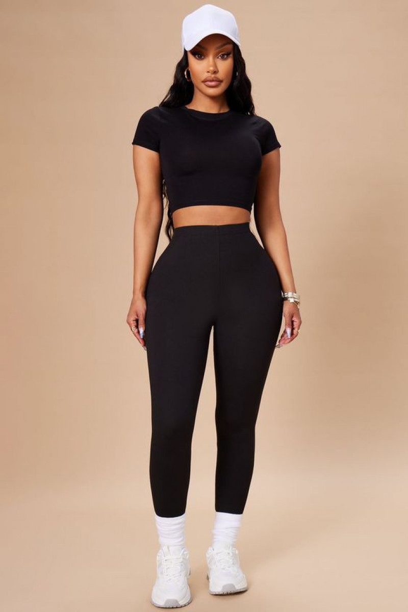 shoulder, off the shoulder, women's clothing, fashion nova, black sportswear legging, black t-shirt, white trainer