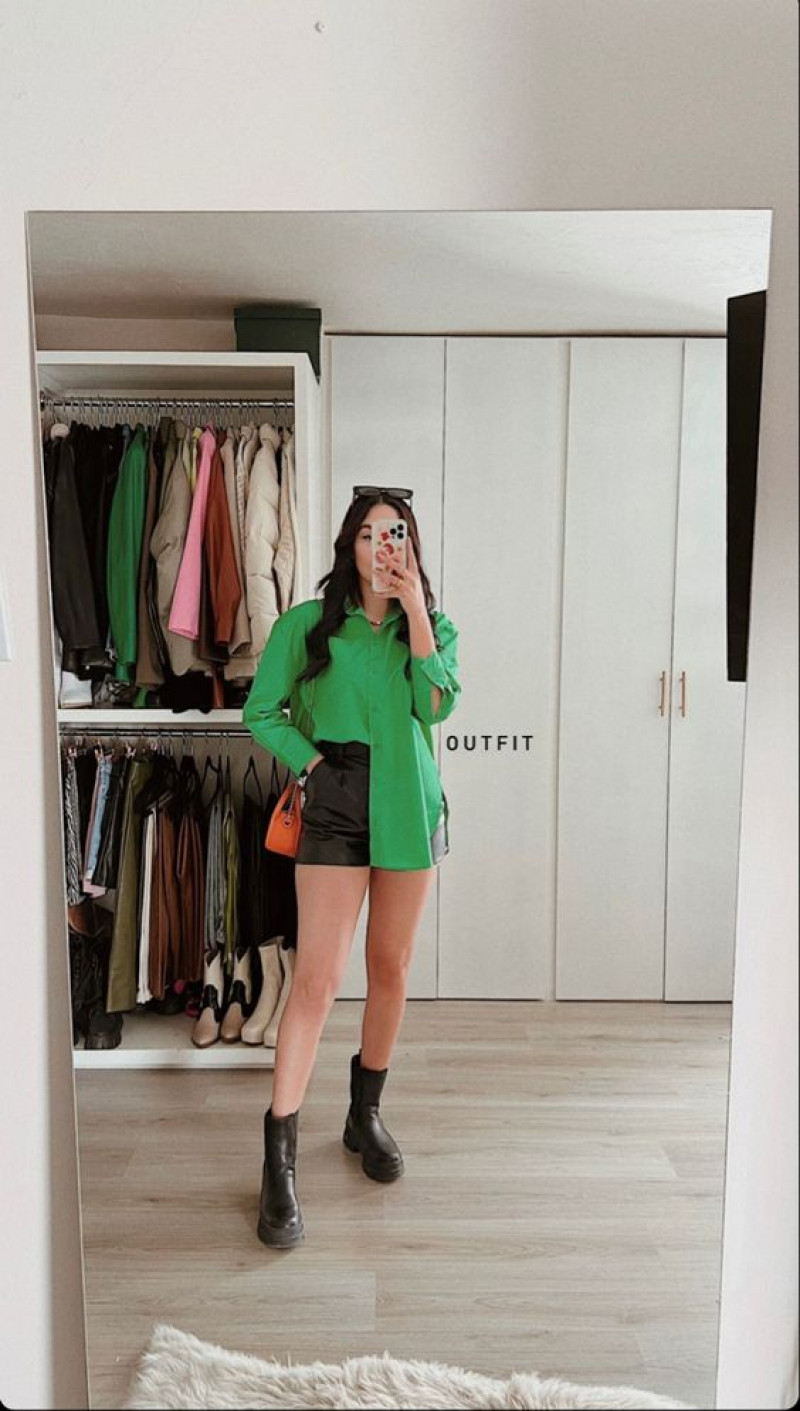 green sweatshirt, black casual boot chelsea and ankle boot