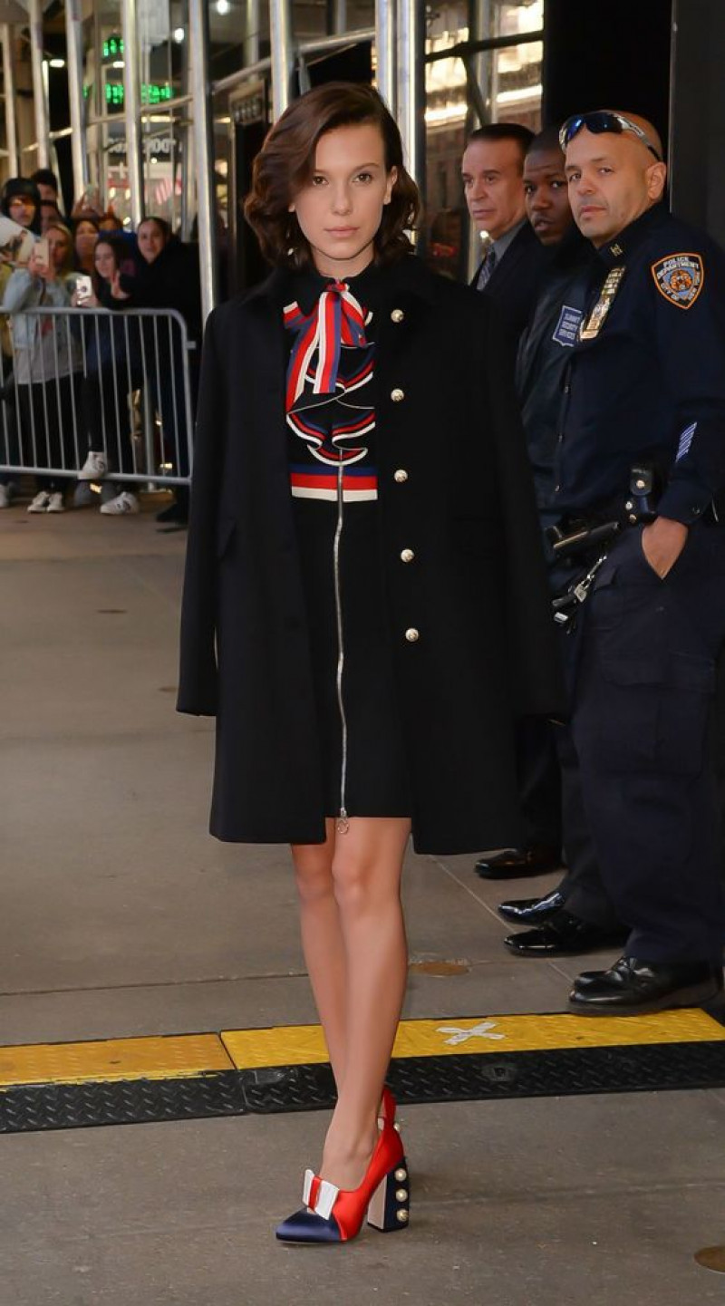 millie bobby brown, formal wear, black wool coat, black free time shoe, millie bobby brown nyc outfits, non-commissioned officer, military uniform, morgane le caer, stranger things, military person, enola holmes 2, bobby brown