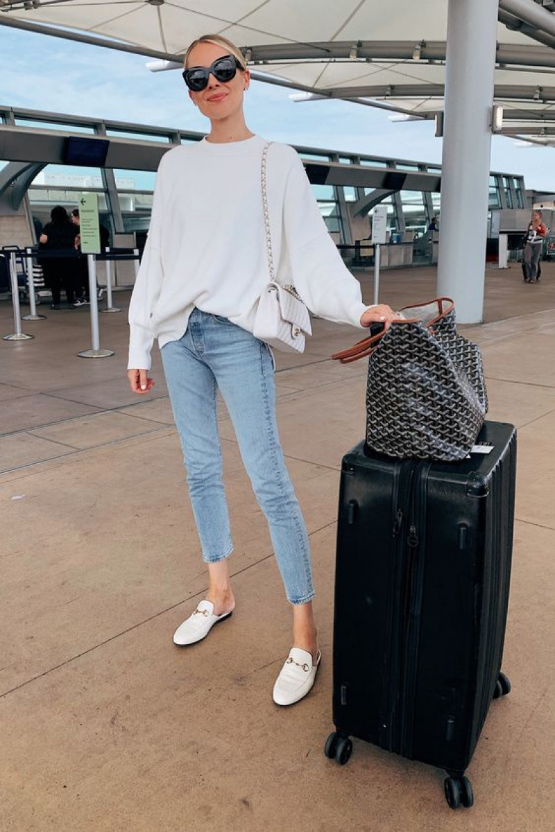 bachelorette airport outfit, luggage and bags, chicago fashion, airport fashion, wedding dress, white blouse, light blue casual trouser, white mule