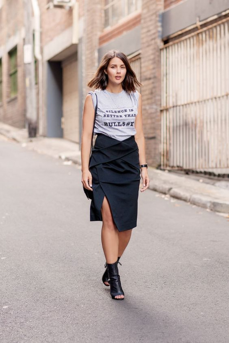 fashion model, blue pencil and straight skirt, white crop top, black elegant boot chelsea and ankle boot