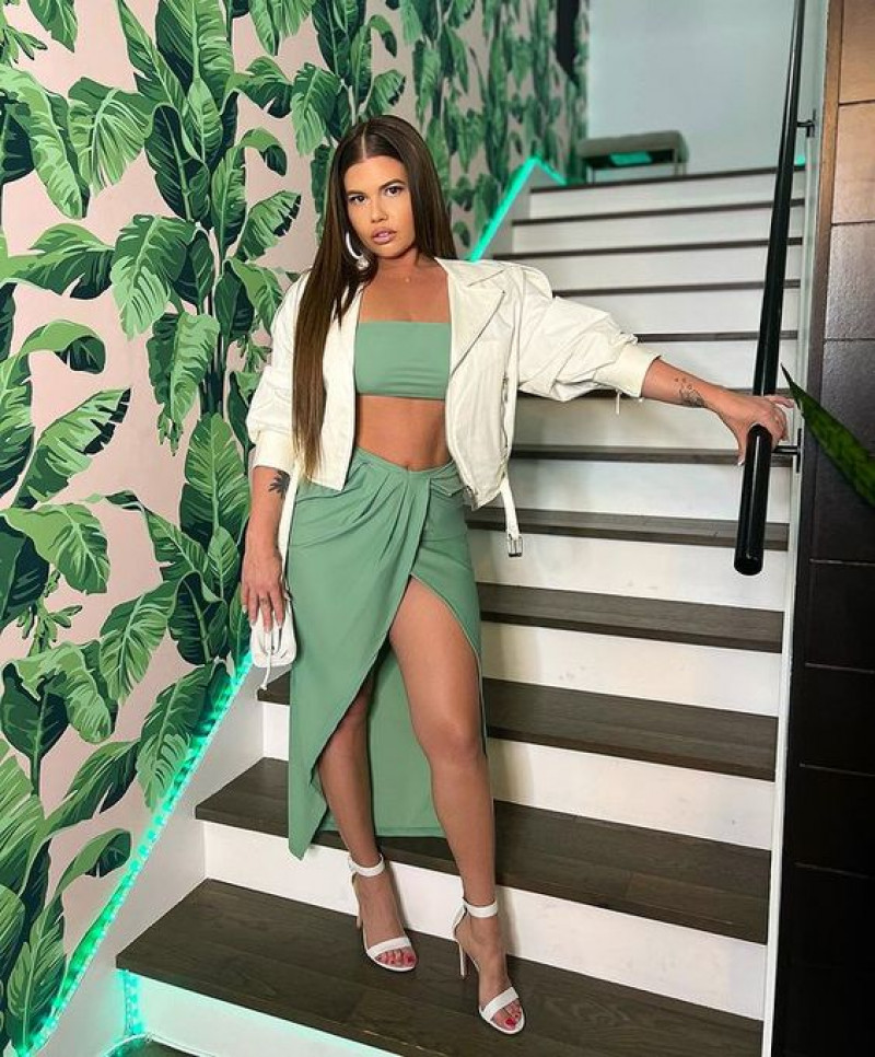 chanel west coast sexy, white bomber jacket, green casual skirt skirt, white formal sandal