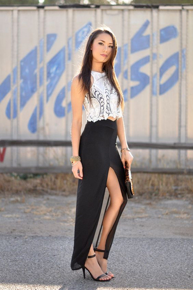 jessica ricks hot, black a-line skirt, white crop top, black formal sandal