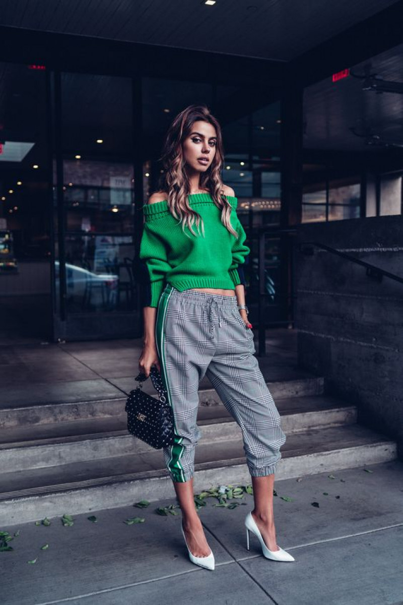 Green sweater and grey pants combo